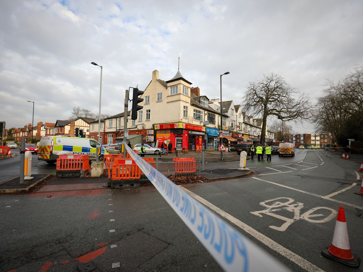 Police and forensics at scene after man, 21, left fighting for his life in horror stabbing