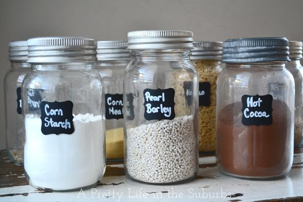 Awesome kitchen organization tips like making mason storage jars with chalkboard labels.