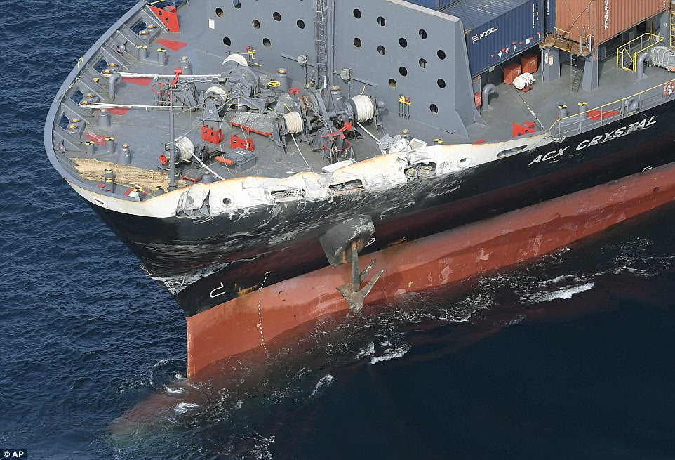 Damage: Damage to the bow of the 29,000 ton cargo ship ACX Crystal after it collided with the USS Fitzgerald
