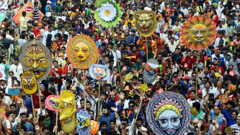 People celebrating Pahela Baishakh at Mangal Shobhajatra (Rally), a procession organised by Dhaka University’s Faculty of Fine Arts to welcome the Bengali new year. Image by Sourav Lasker. Copyright Demotix (14/4/2015)