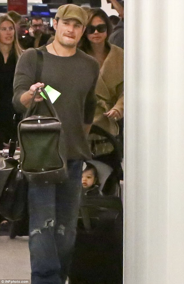 Home for the holidays! Nick and Vanessa Lachey were seen jetting out of LAX airport in Los Angeles on Wednesday with their son Camden