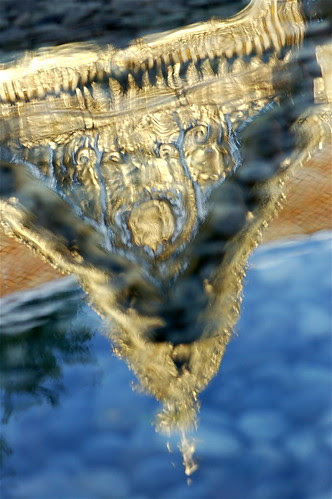 Thai pavilion reflected in pool