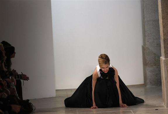 A model falls while presenting a creation by fashion designer Miguel Vieira as part of his Autumn-winter 2012 fashion collection during Lisbon Fashion Week, March 13, 2011. REUTERS-Rafael Marchante