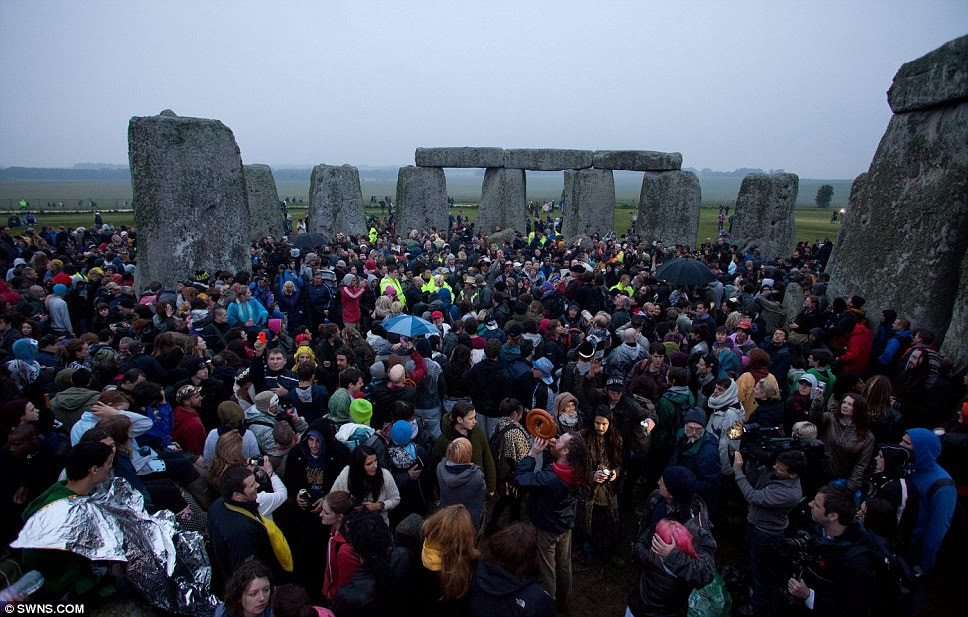 Tight squeeze: The summer solstice annually attracts an eclectic mix of druids, revellers and sun worshippers to Stonehenge