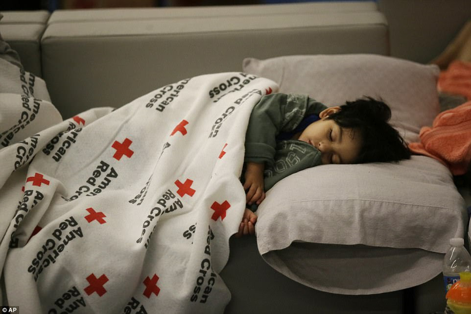 Two-year-old Malachia Medrano sleeps at the George R. Brown Convention Center in Houston, Texas, on Monday night 