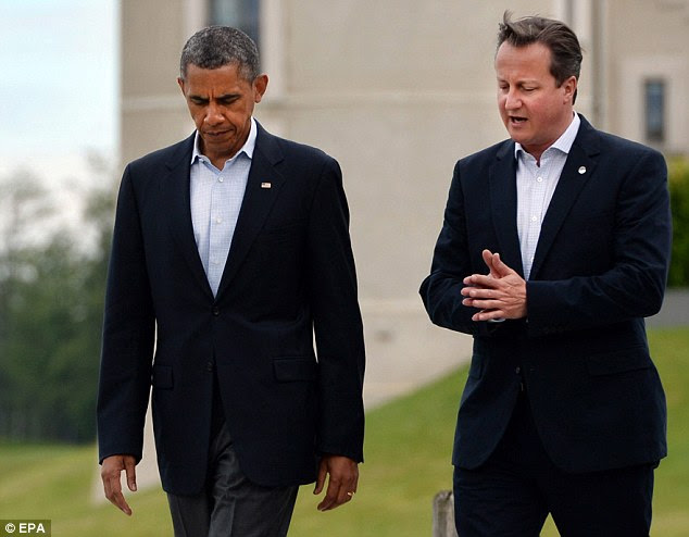 Talks: Prime Minister David Cameron (right) is expected to hold a second telephone call with US President Barack Obama (left) within the next 48 hours to finalise plans for military action (file picture)