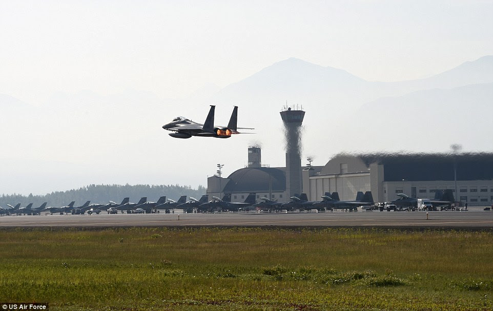Taking off: A U.S. Air Force F-15C Eagle flies over Joint Base Elmendorf-Richardson as part of NE15 in Alaska, which is the U.S.'s largest state with more water and land than any other