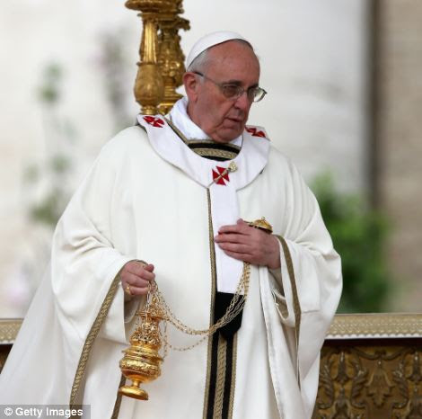Pope Francis prior to delivering his first 'Urbi et Orbi' blessing from the balcony of St. Peter's Basilica during Easter Mass