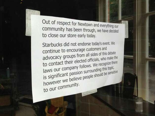 This sign was posted on the front door of Starbucks in Newtown, Conn. after the store closed early on Friday, August 9, 2013.  Many Second Amendment supporters carried their firearms into Starbucks on Starbucks Appreciation Day to exercise their right to bear arms and thank the company for allowing firearms in their stores, as allowed by state law.  However, the Newtown Action Alliance urged gun owners to hold off, saying it is insensitive to the community that is still recovering from the mass shooting at Sandy Hook Elementary School, just over a mile down the street. Photo: Contributed Photo / The News-Times Contributed