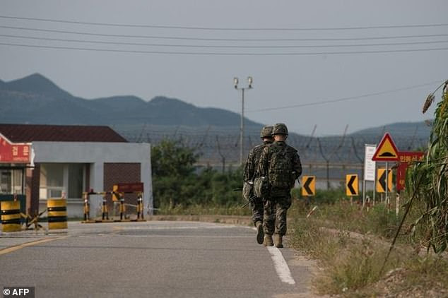 South Korean soldiers walk to a checkpoint near the Demilitarized zone (DMZ) separating North and South Korea, on Ganghwa island