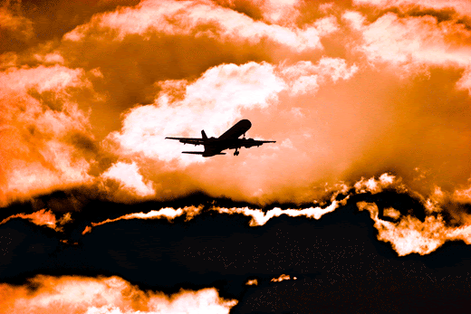 plane into sunset