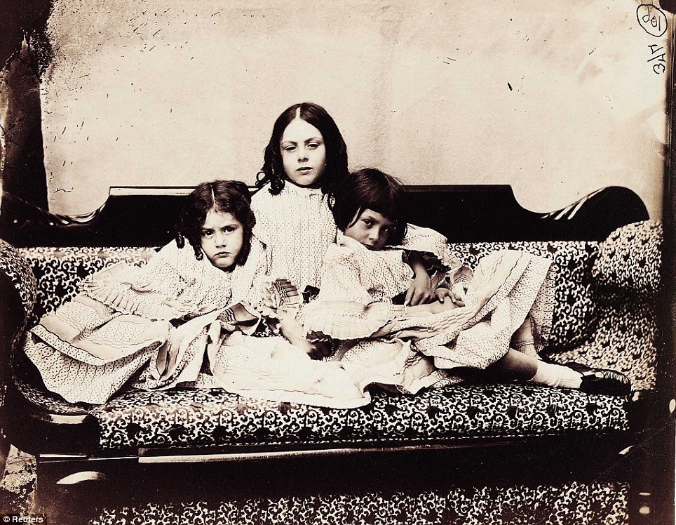 Snapshot: A photograph taken by Lewis Carroll of Alice Liddell (R), his inspiration for Alice in Wonderland, and her siblings Edith (L) and Ina (C)