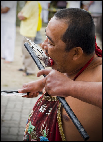 Ma Song cutting himself at Kathu Shrine