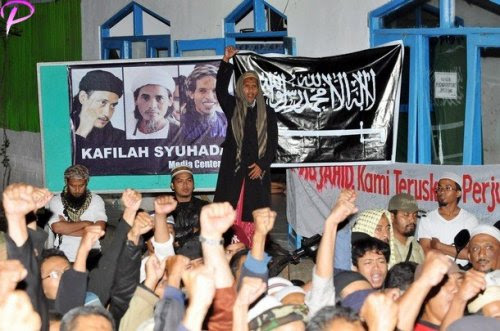 INDONESIA-ATTACK-EXECUTION Brother of the two convicted 2002 Bali bombers Amrozi and Mukhlas, Jafar Shodiq (C, standing) shouts "God is great" along with supporters, at Al Islam boarding school in Tenggulun in the early morning of November 9, 2008 as they hear news that the three Bali bombers have been executed. Three Islamists sentenced to death for the Bali bombings which killed 202 people were executed by firing squad at midnight, local television reported. Amrozi, 47, his brother Mukhlas, 48, and ringleader Imam Samudra, 38, were killed with shots to the heart on the island prison of Nusakambangan off southern Java, TV One television reported quoting an official source.