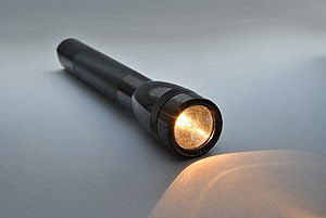 A lit flashlight