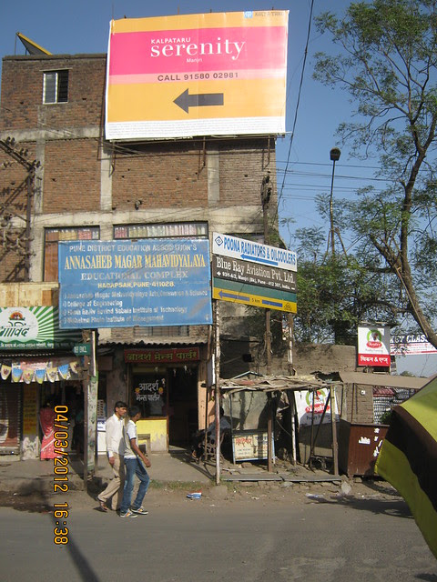 Hoarding at Manjri Phata on Pune Solapur Highway - Visit Kalpataru Serenity, 2 BHK & 3 BHK Flats at Manjri, opp. Navratna Mangal Karyalay, Mahadev Nagar, Pune 412 307