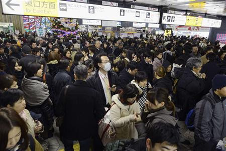 Passengers gather after train services were suspended following an earthquake at Sendai station in Sendai, Miyagi prefecture, in this photo taken by Kyodo December 7, 2012. REUTERS/Kyodo