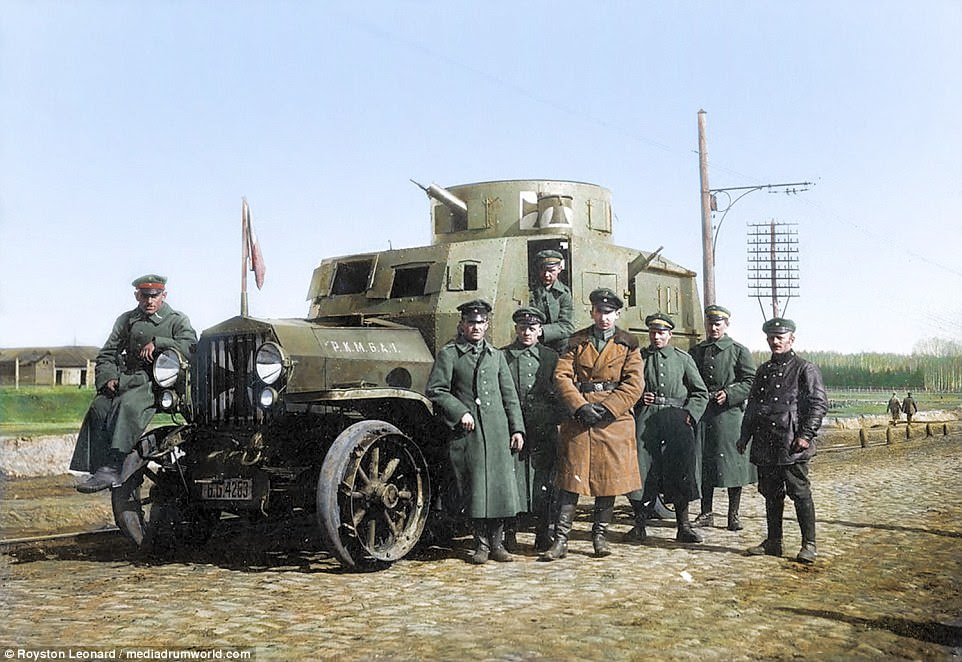 German officers with an armored car, Ukraine, Spring of 1918. They stand next to the car as they smile for the camera