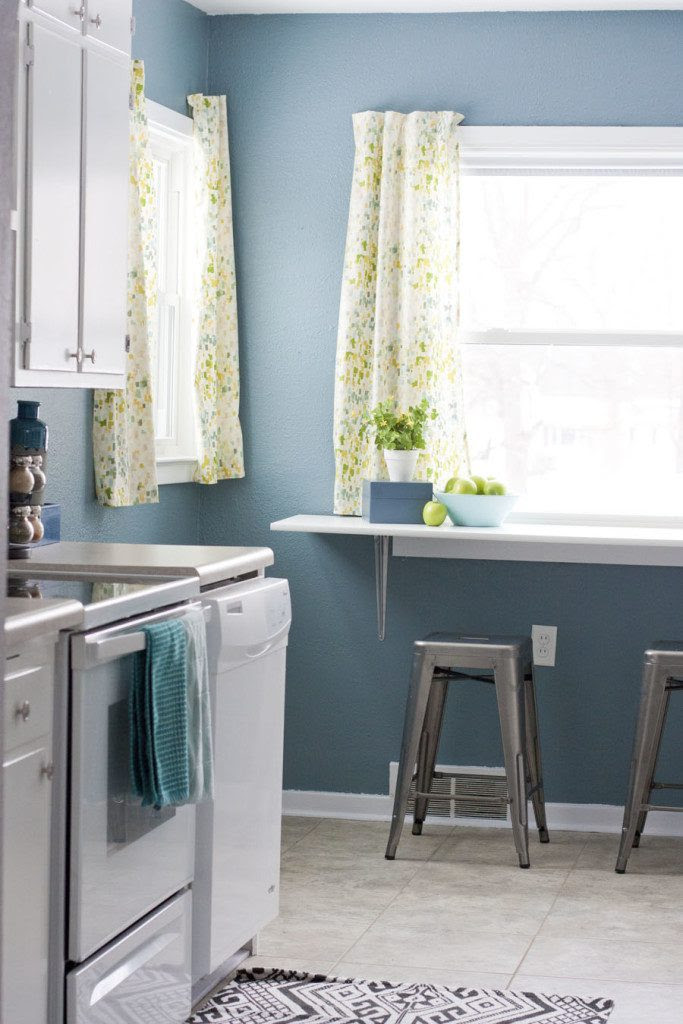 This happy kitchen is full of whites, blues and greens. Shows even small kitchens can look pretty!