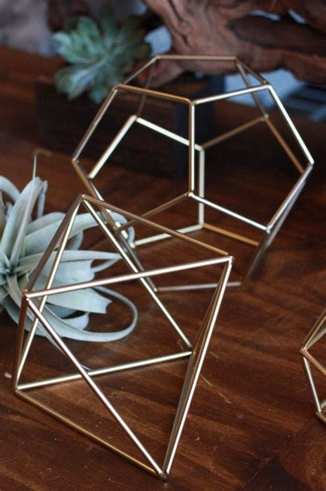 Love these gold geometric prisms for tabletop decor Love these gold geometric prisms for tabletop decor
