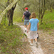 Hiking Two people hike at Alafia River State Park.