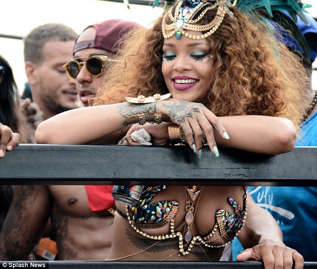 Fun in the sun: Hamilton and Rihanna enjoy the Kadooment Day Parade in Bridgetown, Barbados