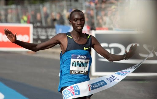 Kenya's Vincent Kipruto is pictured crossing the finish line at the Paris Marathon on April 5, 2009