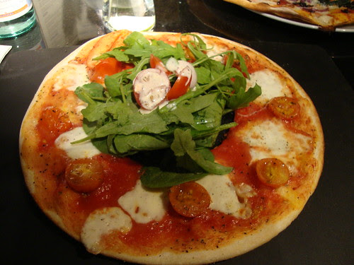 Pizza with hole in middle for salad