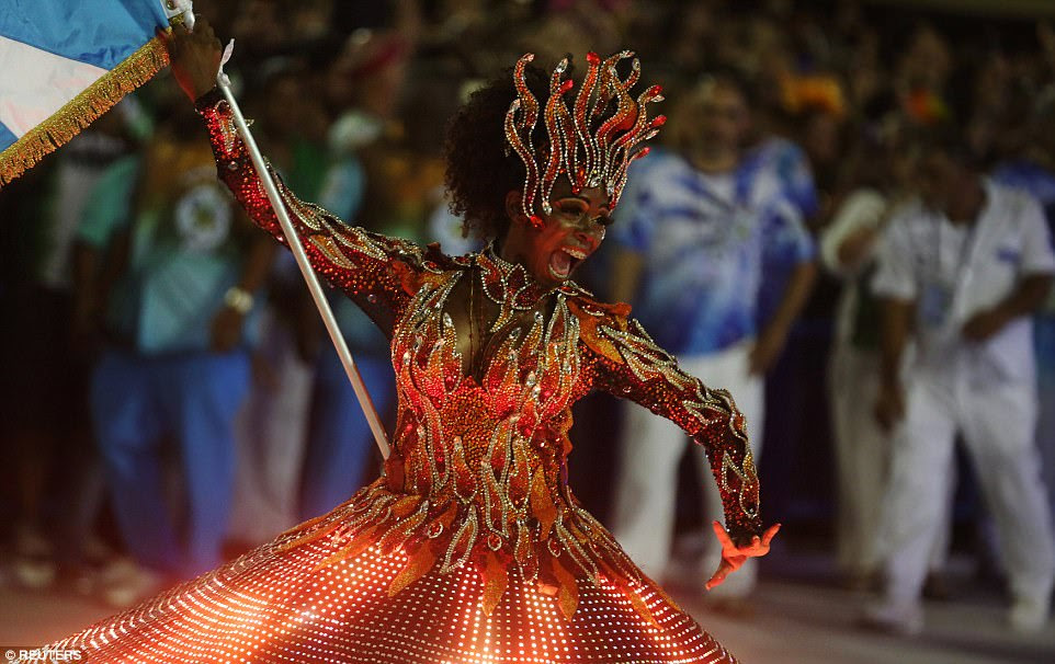 Each school gets about an hour to parade with some 3,000 dancers, singers and drummers dressed in over-the-top costumes. Last year, the contest ended in a draw between the Mocidade and Portela schools. The new champion will be announced on Wednesday