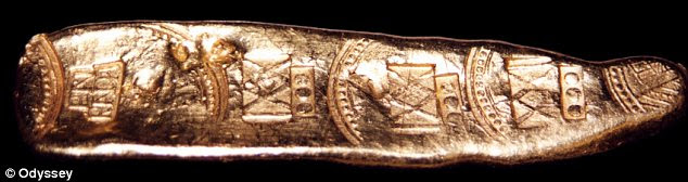 Bullion: A gold bar stamps with official marks certifying its purity and taxation status