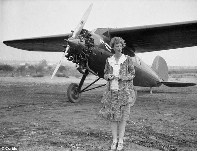 Enduring riddle: American aviator Amelia Earhart, posing by her plane in Long Beach, California, in 1930, disappeared while flying over the Pacific in 1937