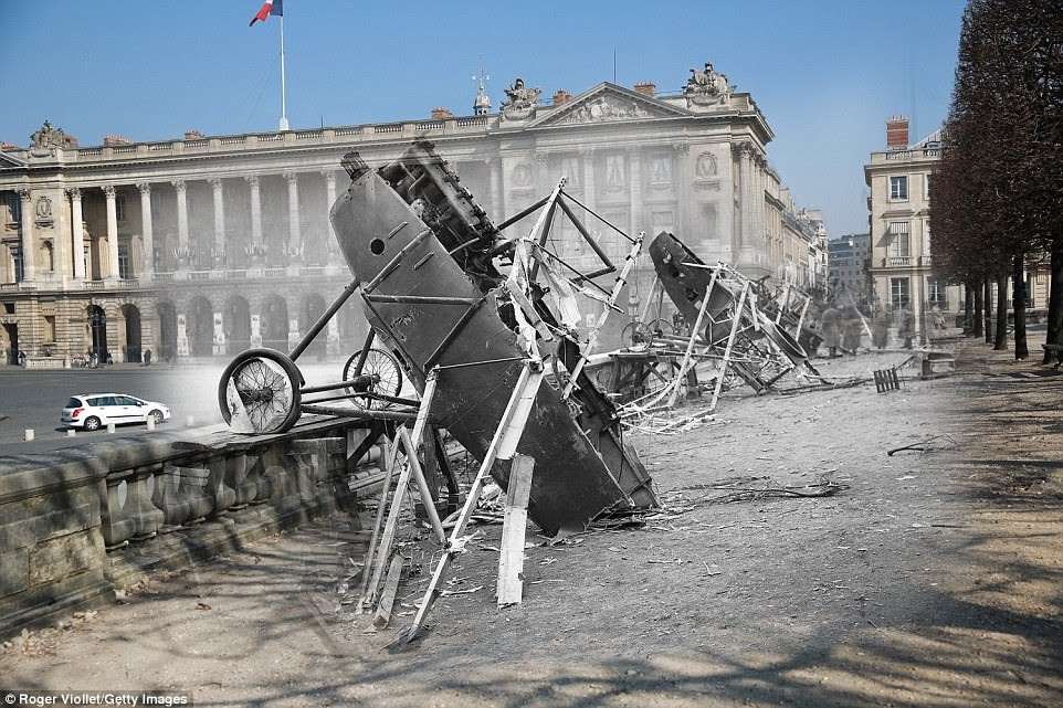 Crashed: The wreckage of a downed German plane is pictured near the Place de la Concord, Paris, in 1914. In the background is a white car travelling through the square