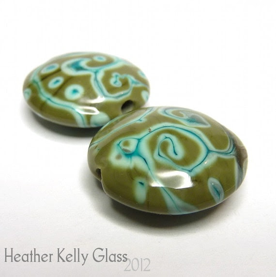 Heather made this pair of lentil beads with an olive green base and scrollwork in a minty green