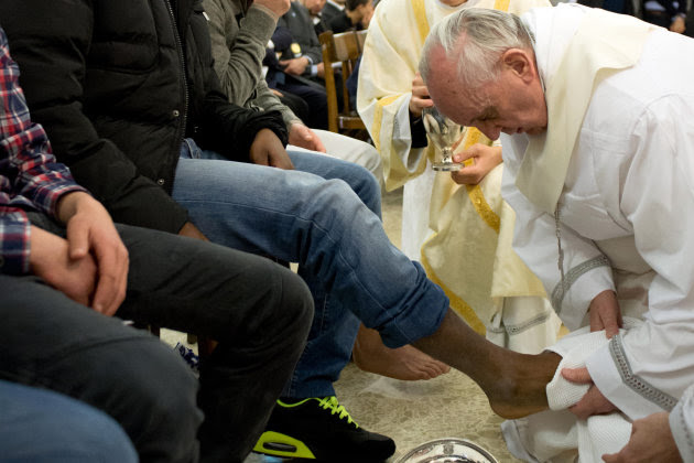 In this photo provided by the Vatican newspaper L'Osservatore Romano, Pope Francis washes the foot of an inmate at the juvenile detention center of Casal del Marmo, Rome, Thursday, March 28, 2013. Francis washed the feet of a dozen inmates at a juvenile detention center in a Holy Thursday ritual that he celebrated for years as archbishop and is continuing now that he is pope. Two of the 12 were young women, an unusual choice given that the rite re-enacts Jesus' washing of the feet of his male disciples. The Mass was held in the Casal del Marmo facility in Rome, where 46 young men and women currently are detained. Many of them are Gypsies or North African migrants, and the Vatican said the 12 selected for the rite weren't necessarily Catholic. (AP Photo/L'Osservatore Romano, ho)