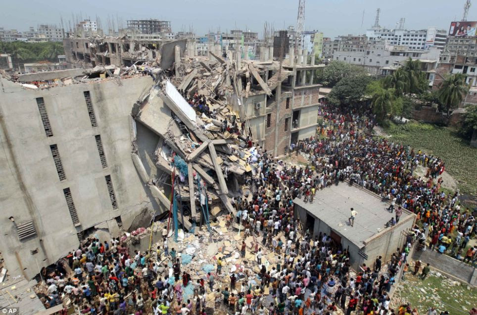 Destroyed: The building housed several garment factories and collapsed near Bangladesh's capital yesterday, killing at least 96 people and trapping many more in the rubble