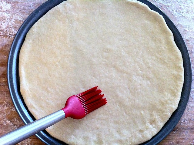 Brushing Pizza Crust with Garlic Oil