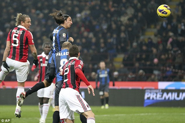 Head boy: Schelotto grabs the equaliser with a perfectly placed header