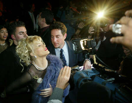 Smith causes a sensation for photographers after the Betsey Johnson fashion show in 2004, in New York City. Photo: KATHY WILLENS, Associated Press