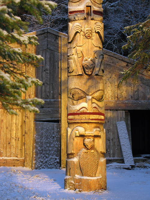 snow on totem in front of Chief Son-i-Hat Whale House, Kasaan, Alaska