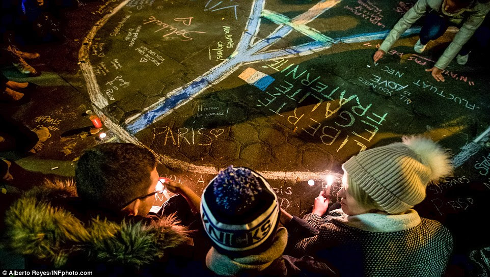 An Eiffel Tower peace sign had been drawn on the ground in New York's Union Square as French students gathered for a candlelit vigil