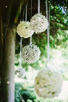 floral ball outdoor wedding ceremony backdrop http://www.weddingchicks.com/2013/09/18/rustic-country-wedding-3/