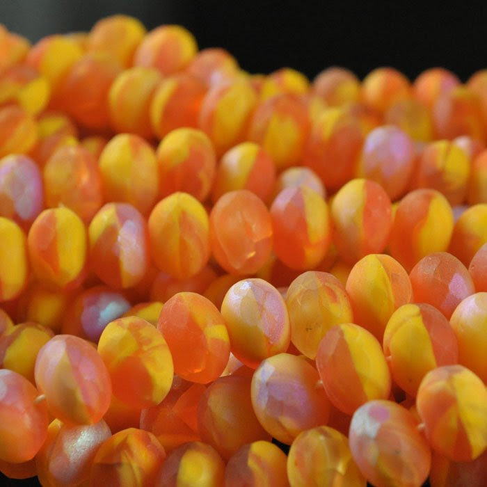 s43839 Firepolish - 9 x 6 mm Faceted Donut - Matte Papaya Swirl (strand 25)