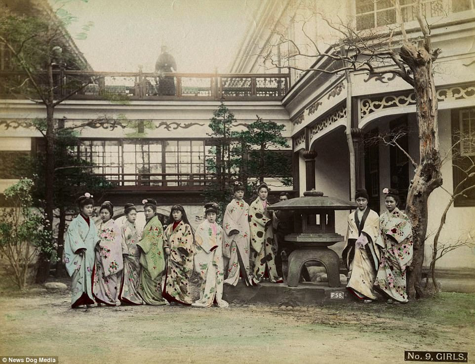 A group of women stand outside the Nectarine No. 9 Brothel - a world famous house of prostitution which was admired by Rudyard Kipling and Nobel-Prize nominee Hideyo Noguchi