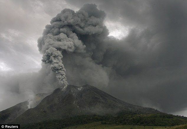 Disruption: Flights have been diverted and thousands evacuated after Mount Sinabung erupted for the first time in 400 years