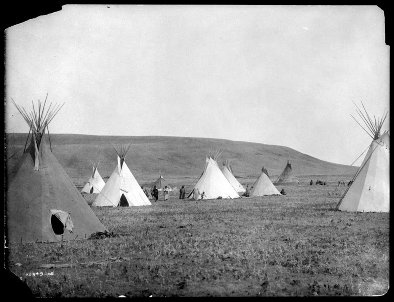 Description of  Title: Atsina camp scene.  <br />Date Created/Published: c1908 November 19.  <br />Summary: Tipis on plains.  <br />Photograph by Edward S. Curtis, Curtis (Edward S.) Collection, Library of Congress Prints and Photographs Division Washington, D.C.