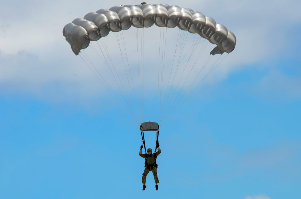 Naval Special Warfare Unit 1, under which 4 SEAL teams are grouped, is also stationed at the naval base. Below is a sailor from the unit performing a free fall parachute in Guam.