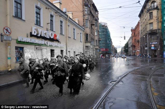 Juxtaposed: Soldiers marching in 1941 down a street in Leningrad - now St Petersburg in 2011