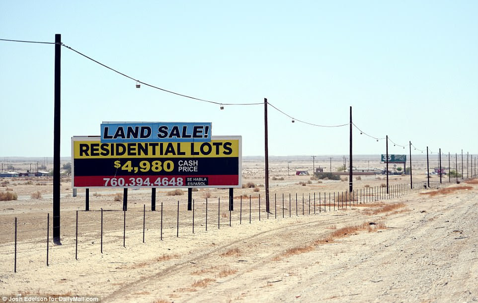 Furthermore, The Pacific Institute estimated that the cost of unchecked dust blown in the wind on public health problems like asthma, lung cancer and cardiac disease could reach as high as $37billion by 2047. Pictured above is a sign advertising land that's for sale in the Salton Sea beach area