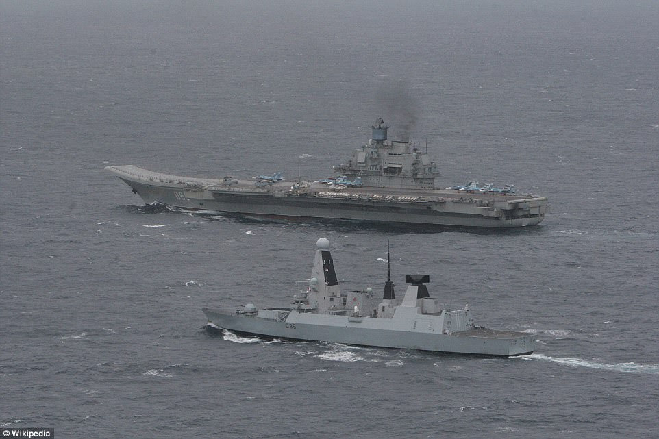 Earlier this year a squadron of RAF Typhoon warplanes were deployed to monitor the ageing Soviet-era vessel, pictured rear, from the air as it passed menacingly close to Britain