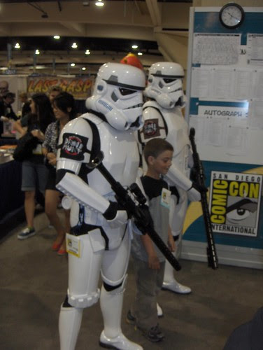 Stormtroopers cart away a young rebel criminal
